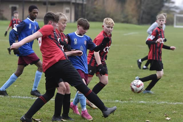 Thorpe Wood Rangers U14's (blue) v March Town Athletic action. Photo: David Lowndes.