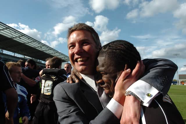 Posh legend Aaron McLean celebrates promotion to the Championship with manager Darren Ferguson in April, 2009.