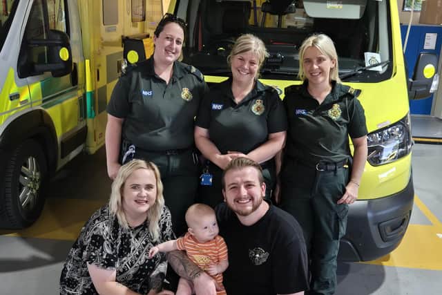 Paramedic Sarah-Jayne Parsons, Senior Emergency Medical Technician Bethany Walesby, and Emergency Care Assistant Amy Rengert with Christian and Jessica Roberts and baby Luca.