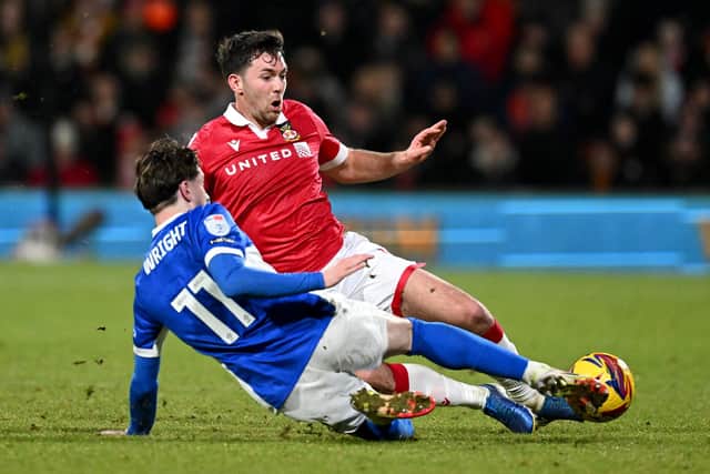 Tom O'Connor (red) in action for Wrexham. Photo by Gareth Copley/Getty Images.