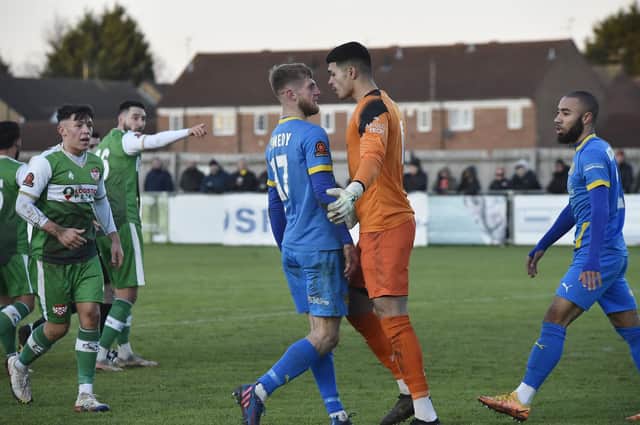 Peterborough Sports' Connor Kennedy (left) v the Kettering Town goalkeeper. Photo: David Lowndes.