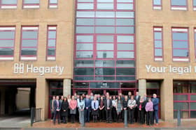 Hegarty’s Peterborough team outside its newly branded office.
