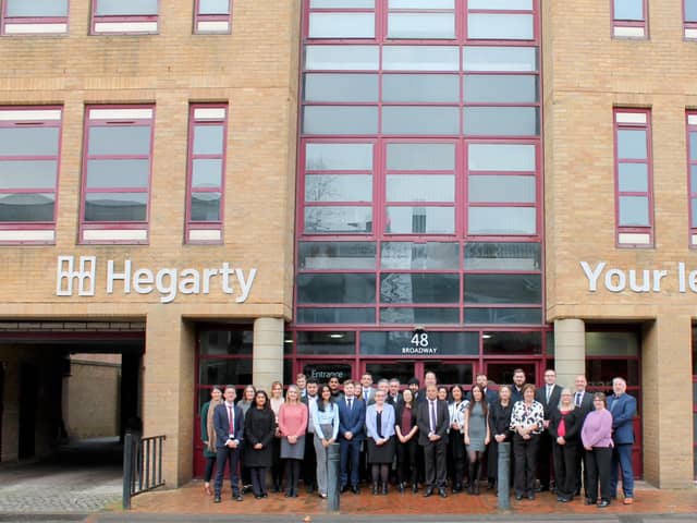 Hegarty’s Peterborough team outside its newly branded office.