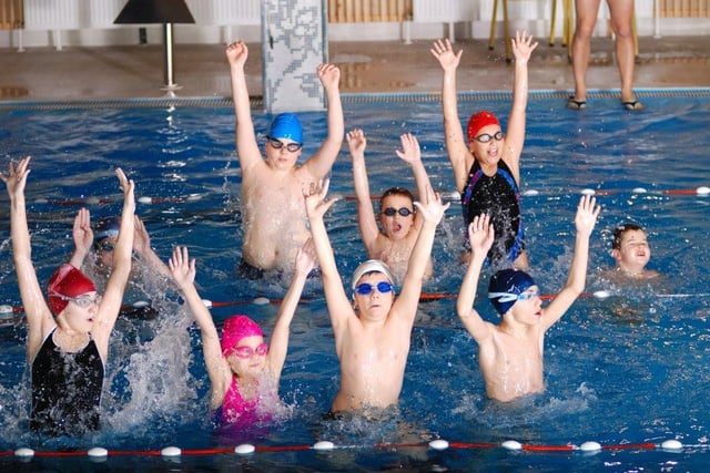 Leisure swimmers pose during an Everyone Active event aimed at boosting fitness levels.