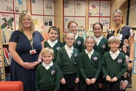 Clara King (right) celebrates the Ofsted result with deputy headteacher Mrs Smallman (left) and proud students from the school council.