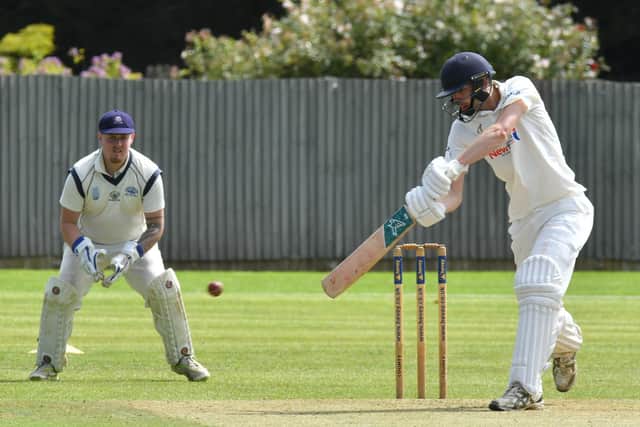 JOsh Smith on his way to an unbeaten ton for Peterborough Town against Rushden & Higham. Photo David Lowndes.