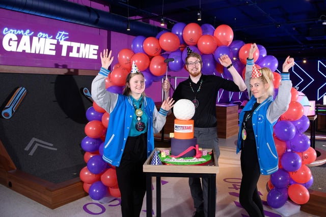 Staff and centre manager, Lewis Johnson, celebrate the first anniversary of mini golf centre Puttstars at the Queensgate Shopping Centre in Peterborough.