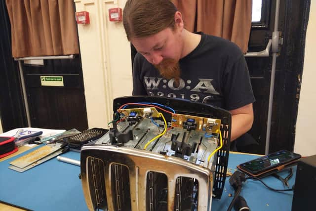 Volunteer repairer Scott - who designs and develop electronic hardware for a living - fixes a toaster at the Yaxley Repair Cafe and volunteers his skills to benefit the community.