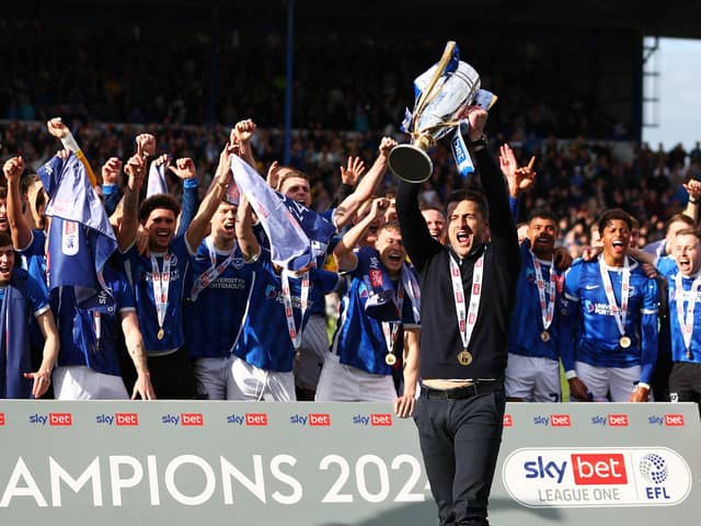 Pompey boss John Mousinho lifts the League One trophy. Photo by Peter Nicholls/Getty Images.