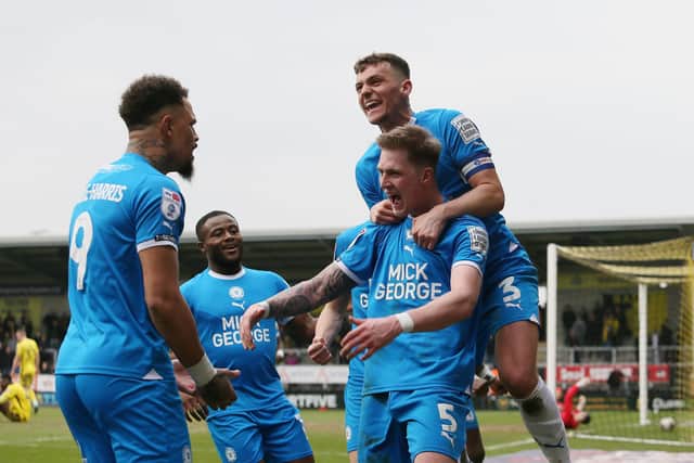 Josh Knight celebrates a goal for Posh at Burton last season. Photo: Joe Dent/theposh.com.