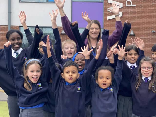 Headteacher Hannah Quinn celebrates with pupils
