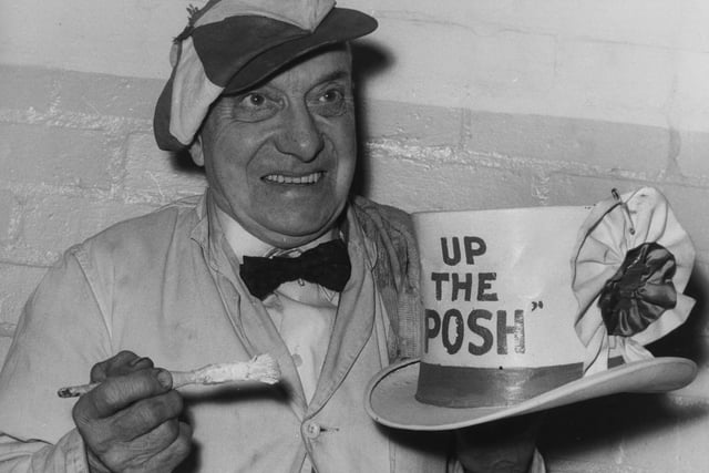 Peterborough United football club's mascot Dusty Hall, painting his hat with the slogan 'Up The Posh', in preparation for his team's fourth round cup tie against Sheffield United.