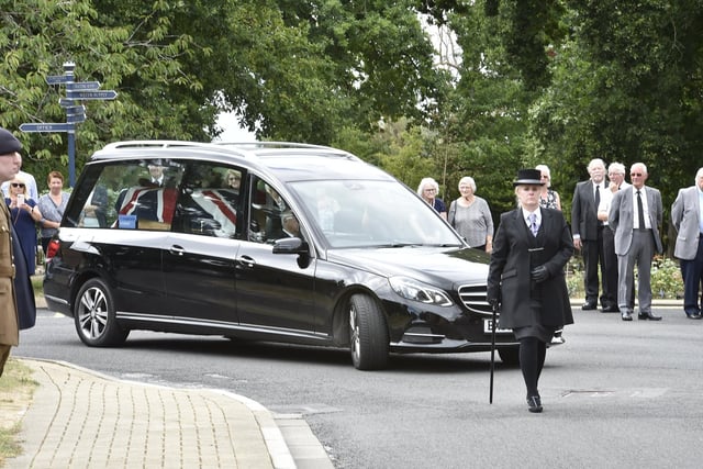 A guard of honour was formed as the hearse arrived