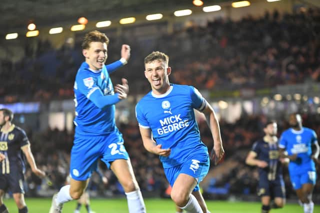 Harrison Burrows celebrates his goal for Posh against Port Vale with Hector Kyprianou. Photo David Lowndes.