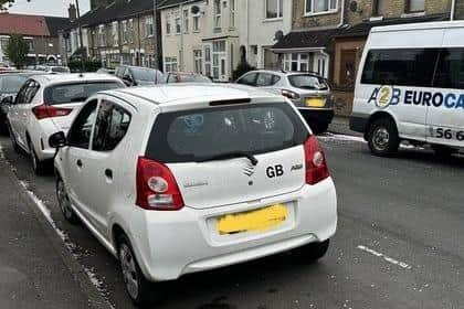 The white Suzuki involved
