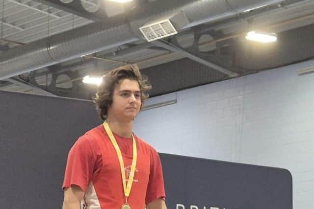 Samuel Ward with his gold medal from the British Age Group Weightlifting Championships.
