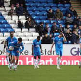 Peterborough United players look dejected after conceding a late goal. Photo: Joe Dent.