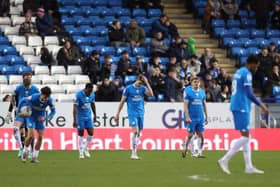 Peterborough United players look dejected after conceding a late goal. Photo: Joe Dent.