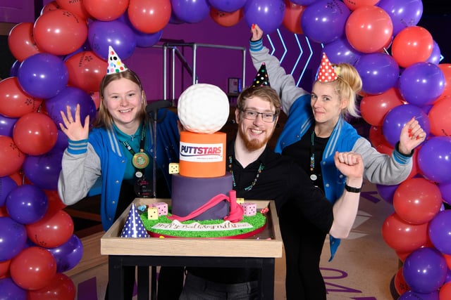 Staff and centre manager, Lewis Johnson, celebrate the first anniversary of mini golf centre Puttstars at the Queensgate Shopping Centre in Peterborough.