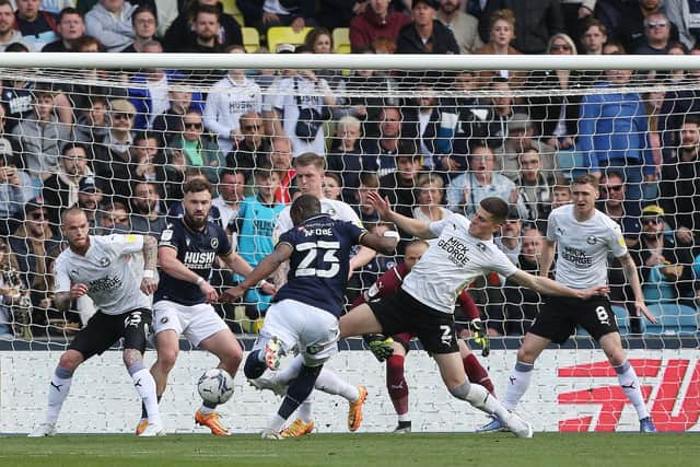 Benik Afobe of Millwall scores his side's opening goal of the game against Posh. Photo: Joe Dent/theposh.com.