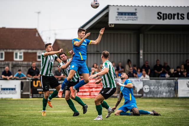 Ex-Kettering Town player Connor Johnson (blue) in action for Peterborough Sports. Photo: James Richardson.