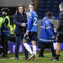 Wycombe Wanderers manager Gareth Ainsworth shakes hands with Posh player Joe Ward after the game. Photo: Joe Dent/theposh.com.