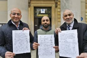 Abid Hussain (centre) presented the petition to North ward candidates Mohammed Haseeb (left) and Ansar Ali (right) at Peterborough Town Hall