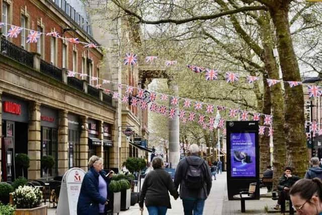 Coronation flags have gone up in Peterborough City Centre to mark the three-day royal weekend (image: David Lowndes)