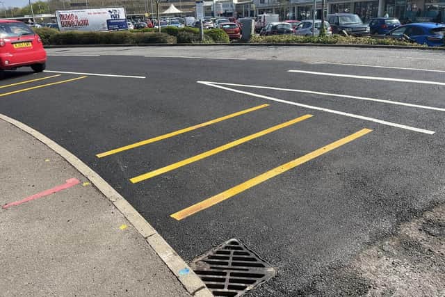 A section of relaid tarmac at the entrance to Bretton centre. Photo: Councillor Chaz Fenner.