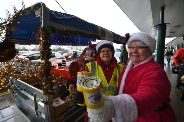 Abby Heslin and Gaby Sharman volunteers on the Peterborough Lions Christmas sleigh.