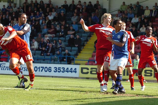 Nathanael Mendez-Laing (left) scores the 100th Posh goal of the 2010-11 League One season at Rochdale. Photo David Lowndes.
