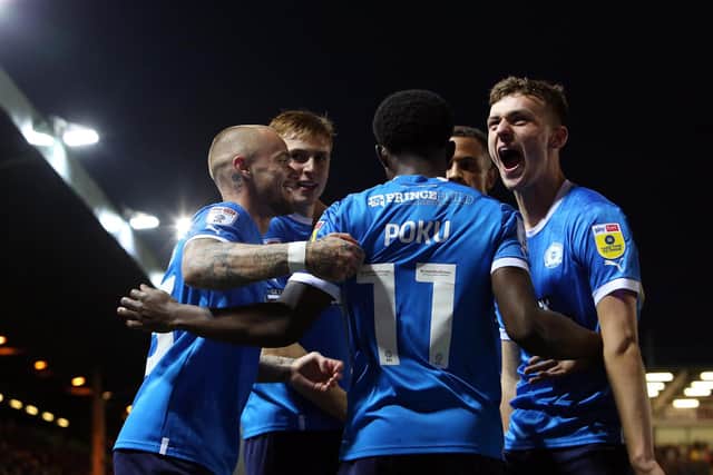 Harrison Burrows (right) enjoys the celebrations after Kwame Poku's goal v Sheffield Wednesday. Photo: Joe Dent/tehposh.com.