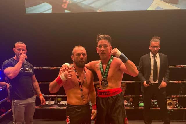 Martin Reffell (right) with beaten opponent Ionel Levitchi.