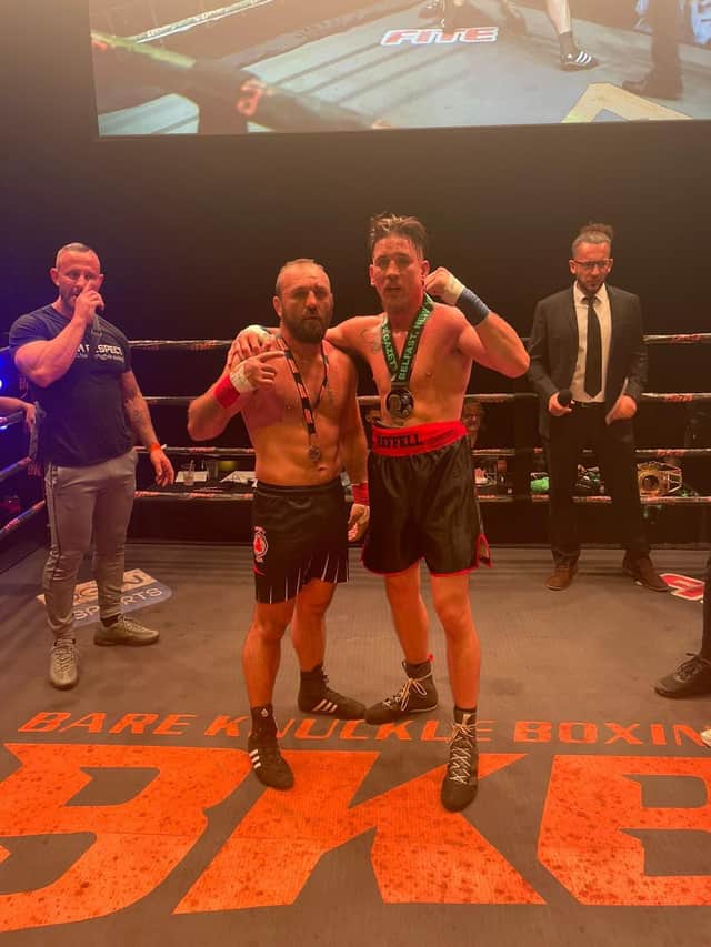Martin Reffell (right) with beaten opponent Ionel Levitchi.