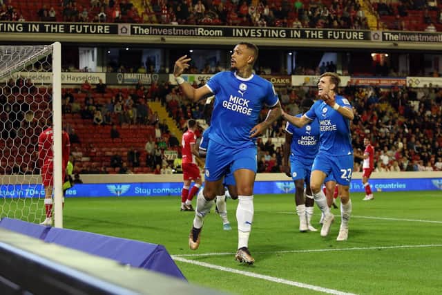 Jonson Clarke-Harris of Peterborough United celebrates his goal at Barnsley. Photo: Joe Dent/theposh.com