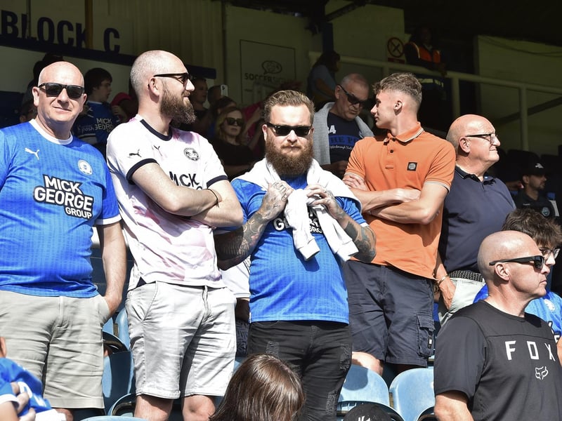 Peterborough United fans watch the draw with Leyton Orient.