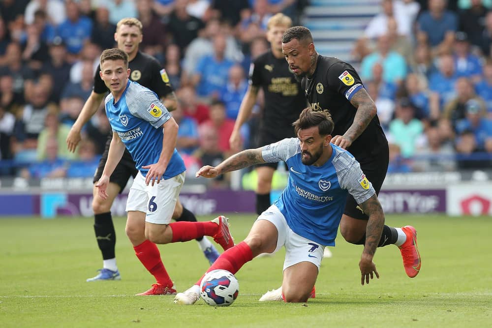 Posh skipper Jonson Clarke-Harris in action with Marlon Pack of Portsmouth. Joe Dent/theposh.com