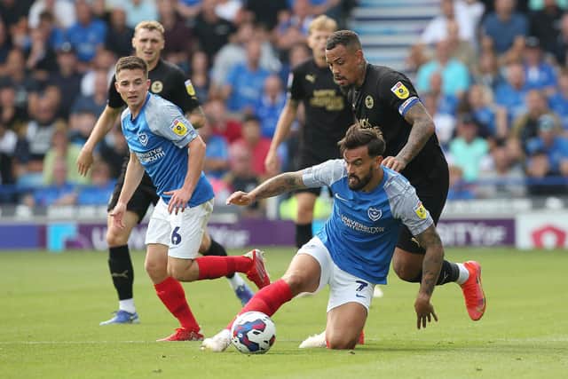 Posh skipper Jonson Clarke-Harris in action with Marlon Pack of Portsmouth. Joe Dent/theposh.com