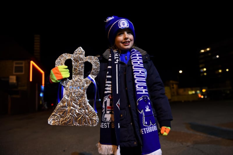 A fan poses with a tin foil FA Cup outside the stadium before the Emirates FA Cup fourth round replay match between Peterborough United and West Bromwich Albion at ABAX Stadium on February 10, 2016.