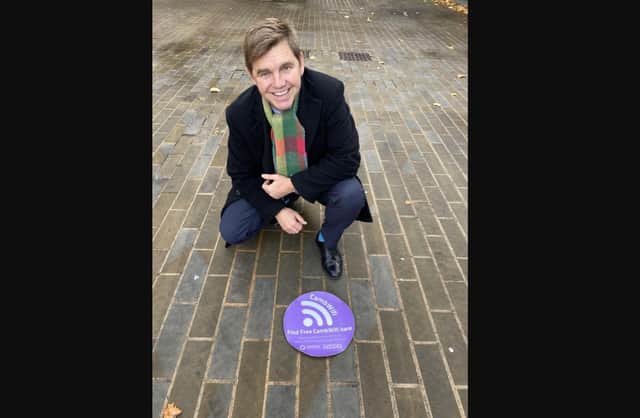 Mayor of Cambridgeshire and Peterborough Nik Johnson with one of the new purple wifi stickers.