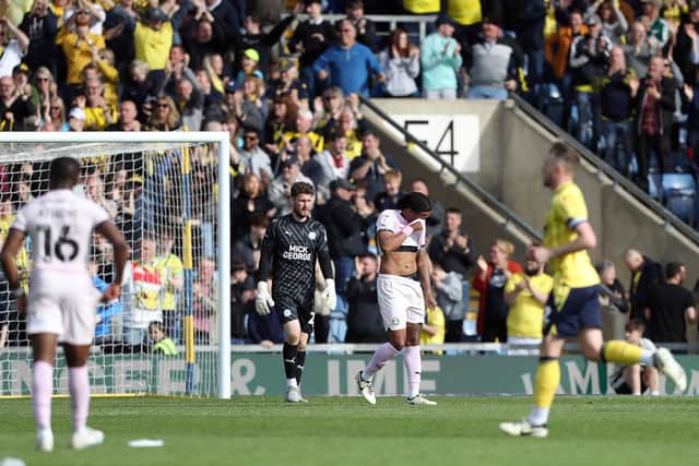 Romoney Crichlow hides his face as Oxford rack up the goals. Photo: Joe Dent.