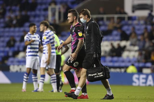 Jack Marriott limps off after picking up a serious injury at Reading in September. Photo: Joe Dent/theposh.com