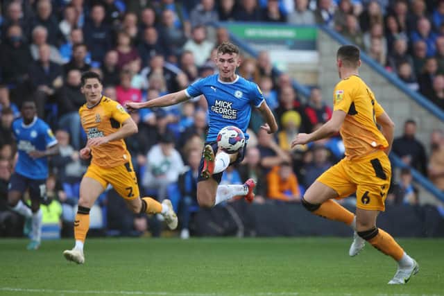 Harrison Burrows of Peterborough United controls the ball against Cambridge United. Photo: Joe Dent/theposh.com.