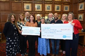 Cllr Judy Fox hands over her Mayor's Charity cheques to representatives from the Peterborough Area Down's Syndrome Group and Sue Ryder at the Town Hall.