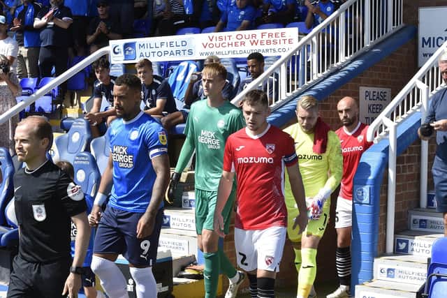 Posh goalkeeper Lucas Bergstrom (green shirt) before the game against Morecambe. Photo: David Lowndes.