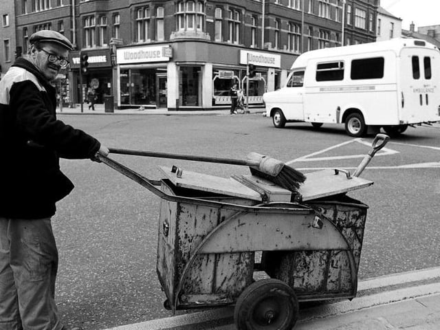 One of the city's ever-reliable street cleaners going about his round
