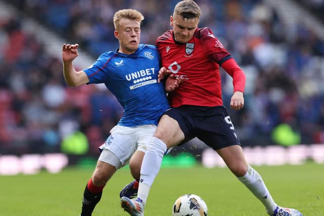 Ronan Hale (red) playing for Ross County against Rangers last season. (Photo by Ian MacNicol/Getty Images)