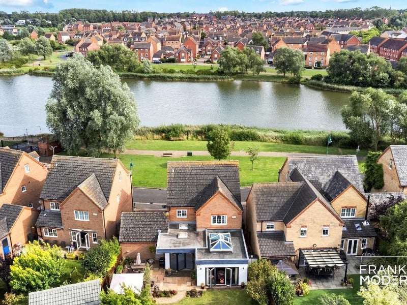 An aerial view of the property (pictured third from left) with The Serpentine Lake seen at the front