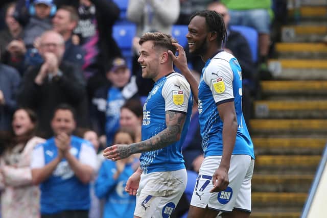 Sammie Szmodics of Peterborough United (left) celebrates scoring with team-mate Ricky-Jade Jones. Photo: Joe Dent/theposh.com