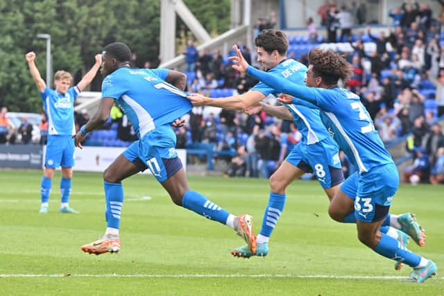 Posh celebrate Kwame Poku's last-gasp winner against Stevenage. Photo David Lowndes.